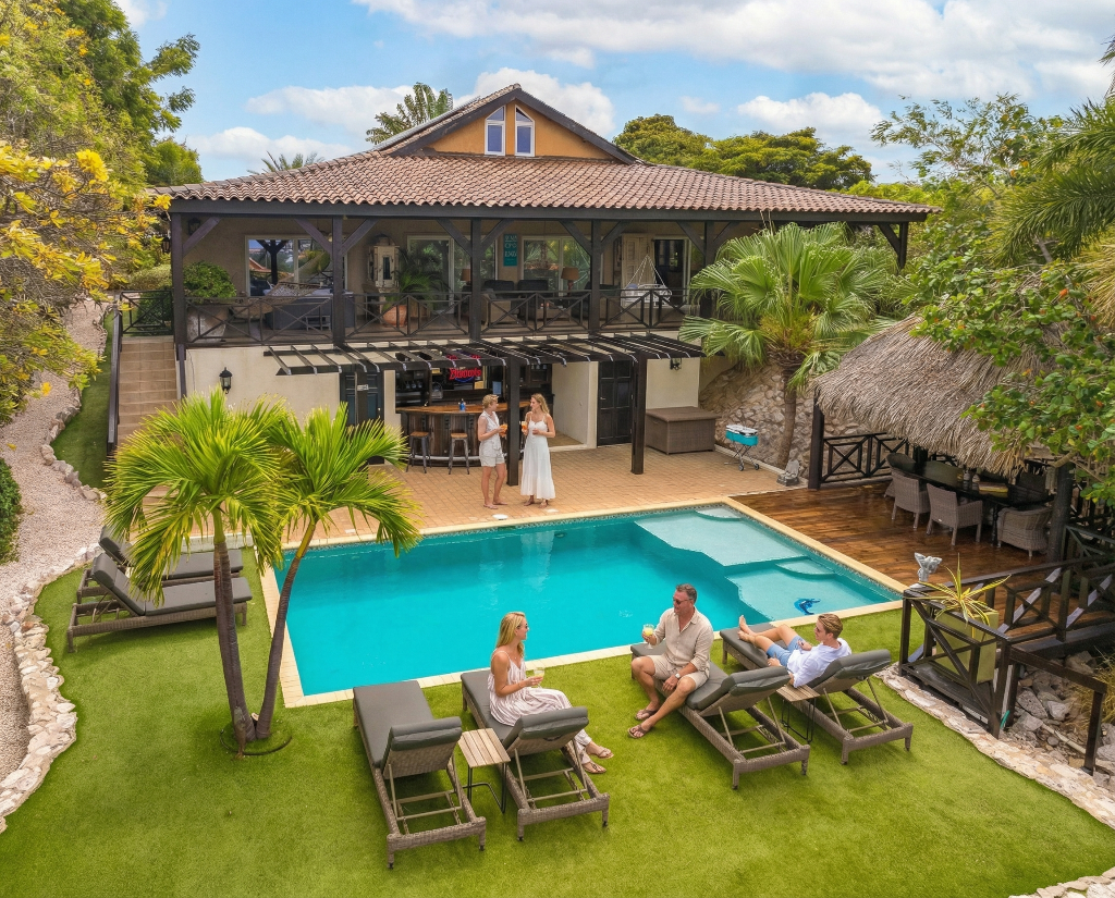 Bayside Hill - Aerial view of luxury villa with pool, palapa bar, and tropical gardens