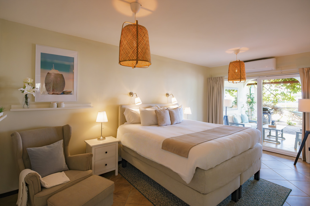 First king bedroom opening onto the porch at Tropical Haven